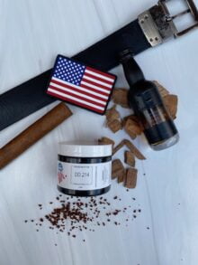 DD214 Beard Butter offers a captivating blend of bourbon, whiskey, Cuban tobacco, coffee, gunpowder, and energy drink scents. Experience a royal treatment for your beard, evoking adventure and camaraderie.